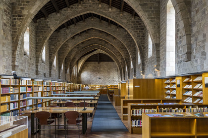 Spain, Catalonia, Barcelona, El Raval District, the former Hospital of the Holy Cross (Hospital Sant Pau - Santa Creu) in Catalan Gothic style, today the Library of Catalonia