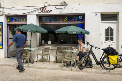 France, Charente Maritime, Soubise, break from cycling on a café terrace