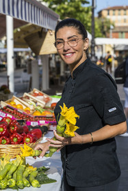 France, Alpes-Maritimes, Nice, listed as World Heritage by UNESCO, Old Nice, the Cours Saleya market, Virginie Acchiardo, chef of the restaurant Chez Acchiardo in rue Droite, buy organic zucchini in bloom