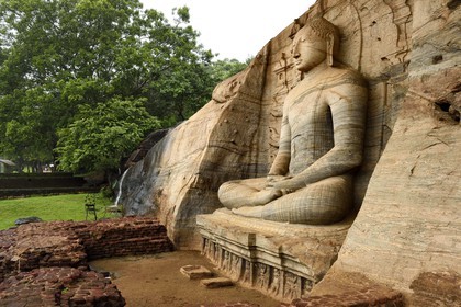 Sri Lanka,  North Central province, Polonnaruwa, the former capital of the country (11th to 13th century) listed as World Heritage by UNESCO, huge buddha cut in rock of Gal Vihara, seated Buddha with clasped hands cupped in dhyana mudra meditation position