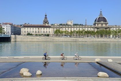 France, Rhone, Lyon, the banks of the Rhone river, the quay Victor Augagneur in the foreground, the hospital of Hotel Dieu and the Notre Dame de Fourviere Basilica, historical site listed as World Heritage by UNESCO, in the background