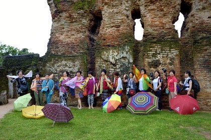 Sri Lanka,  North Central province, Polonnaruwa, the former capital of the country (11th to 13th century) listed as World Heritage by UNESCO, Chinese tourists in front of the Royal Palace ruins