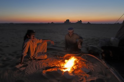 Egypt, Libyan Desert, bivouac in the White Desert North of Farafra, campfire at dusk