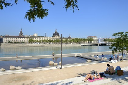 France, Rhone, Lyon, the banks of the Rhone river, the quay Victor Augagneur in the foreground, the hospital of Hotel Dieu and the Notre Dame de Fourviere Basilica, historical site listed as World Heritage by UNESCO, in the background