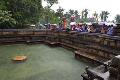 Sri Lanka,  North Central province, Polonnaruwa, the former capital of the country (11th to 13th century) listed as World Heritage by UNESCO, Palais Royal, the Prince bath (Kumara Pokuna), guided tour by a Buddhist monk