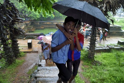 Sri Lanka,  North Central province, Polonnaruwa, the former capital of the country (11th to 13th century) listed as World Heritage by UNESCO, Palais Royal, young visitors at the Prince bath (Kumara Pokuna)