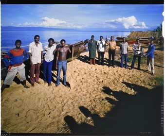 Burundi, Rumonge Province, group of fishermen on Lake Tanganyika, fishermen are exclusively Hutu and come down from the  hills to settle in temporary huts for at least 6 months, fishing is generally done at night with lampara and it's mainly ndagalas (fried fish) mukekes and Lates niloticus (4x5 reversal film reproduction)