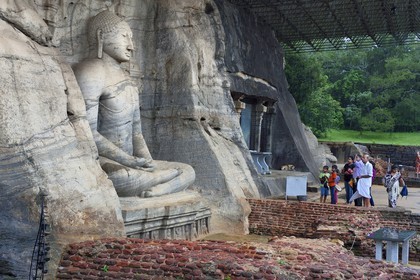 Sri Lanka,  North Central province, Polonnaruwa, the former capital of the country (11th to 13th century) listed as World Heritage by UNESCO, huge buddha cut in rock of Gal Vihara, seated Buddha with clasped hands cupped in dhyana mudra meditation position