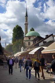 Bosnia and Herzegovina, Sarajevo, Bascarsija district in the old town, Bravadziluk street famous for its Burek and cevapi restaurants, Bascarsijska mosque (Bascarsijska dzamija) in the background
