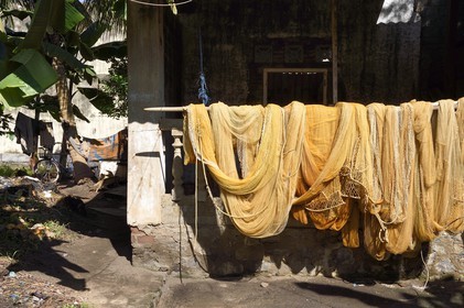 Sri Lanka, Western Province, Negombo, fishing net drying in the sun outside the house of a fisherman