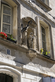 France, Vaucluse, Avignon, rue des Lices, one of the hundreds of Virgin Marys that adorn the facades of the houses, vestige of an oil lamp on its left