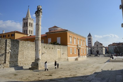 Croatia, Dalmatia, Dalmatian Coast, Zadar, Roman forum, the column of disgrace served to attach theives and female adulterers, the Cathedral bell tower, Sveti Donat Cupola and St Mary Church in the background
