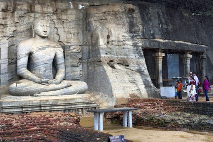 Sri Lanka,  North Central province, Polonnaruwa, the former capital of the country (11th to 13th century) listed as World Heritage by UNESCO, huge buddha cut in rock of Gal Vihara, seated Buddha with clasped hands cupped in dhyana mudra meditation position