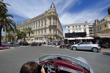 France, Alpes-Maritimes, Cannes, the Carlton palace on the boulevard de la Croisette, aboard a collection convertible Porsche Speedster 356