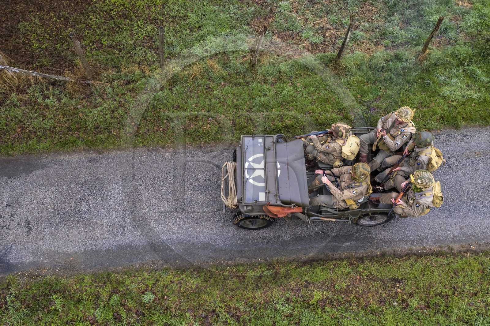 France, Eure, Sainte Colombe prés Vernon, Allied Reconstitution Group (US World War 2 and french Maquis historical reconstruction Association), reenactors in uniform of the 101st US Airborne Division progressing in a jeep Willys (aerial view)