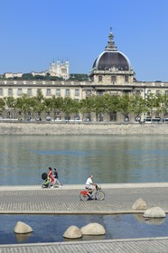France, Rhone, Lyon, the banks of the Rhone river, the quay Victor Augagneur in the foreground, the hospital of Hotel Dieu and the Notre Dame de Fourviere Basilica, historical site listed as World Heritage by UNESCO, in the background