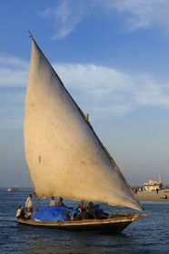 Tanzania, Zanzibar Archipelago, Unguja island (Zanzibar), west coast, a dhow (traditional Arab sailing vessel) in front of Stone Town beach