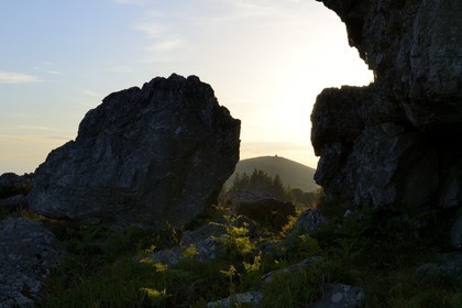 France, Finistere, Parc Naturel Regional d'Armorique (Armorica Regional Natural Park), Monts d'Arree, Brasparts, rock of Druid exorcisms of the marsh Yeun-Elez leading to the Youdig (one of the hell gates) and the Saint Michel chapel at the top of Menez Mikael in the background