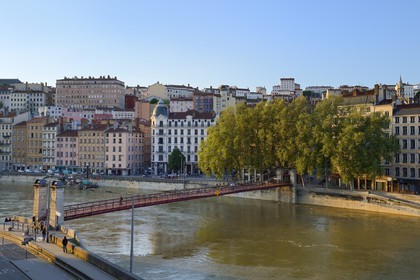 France, Rhone, Lyon, historical site listed as World Heritage by UNESCO, Quai Bondy, the Saint Vincent Footbridge over the Saone River and the Croix Rousse District in the background