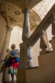 France, Alpes-Maritimes, Nice, listed as World Heritage by UNESCO, Old Nice, Palais des Cais de Gilette from the 17th century, the designer, illustrator and book author Sylvie T in the stairwell with grotesque decoration