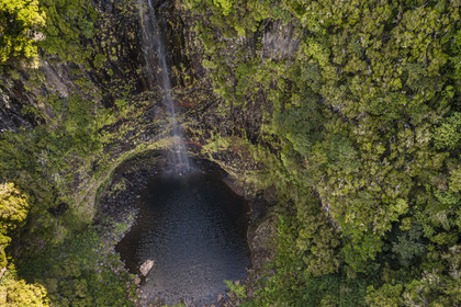 Portugal, Madeira Island, hike in the forest of Rabaçal by the levada do Alecrim, 80 meter high Lagoa do Vento waterfall (aerial view)