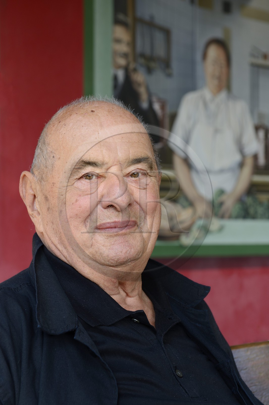France, Rhone, Collonges au Mont d'Or, L'Auberge du Pont de Collonges Paul Bocuse Restaurant, three Michelin stars since 1965, famous French chef Paul Bocuse in front of the painted wall portraying French chef cook Eugenie Brazier called the mere Brazier