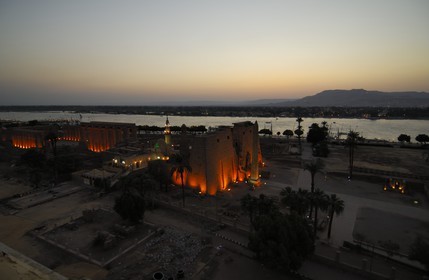 Egypt, Upper Egypt, Nile Valley, Luxor Temple at dusk, listed as World Heritage by UNESCO and the Nile