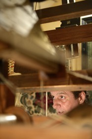 France, Rhone, Lyon, historical site listed as World Heritage by UNESCO, Vieux Lyon (Old Town), Saint George district, Ludovic de la Calle working on a Jacquard loom at the silk trade (Soierie) Saint-Georges