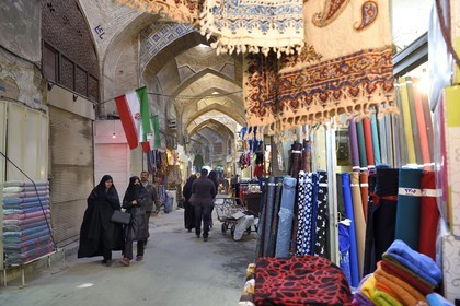Iran, Isfahan Province, Isfahan, Bazar-e Bozorg (Great Bazaar), a massive covered bazaar which dates back almost 1300 years, fabrics store