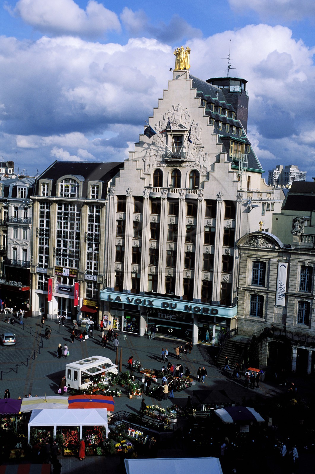 France, Nord, Lille, famous building from the newspaper la Voix du Nord and the flowers market on general de Gaulle square (Grand' Place)
