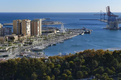 Spain, Andalusia, Malaga, the harbour cranes and the lighthouse