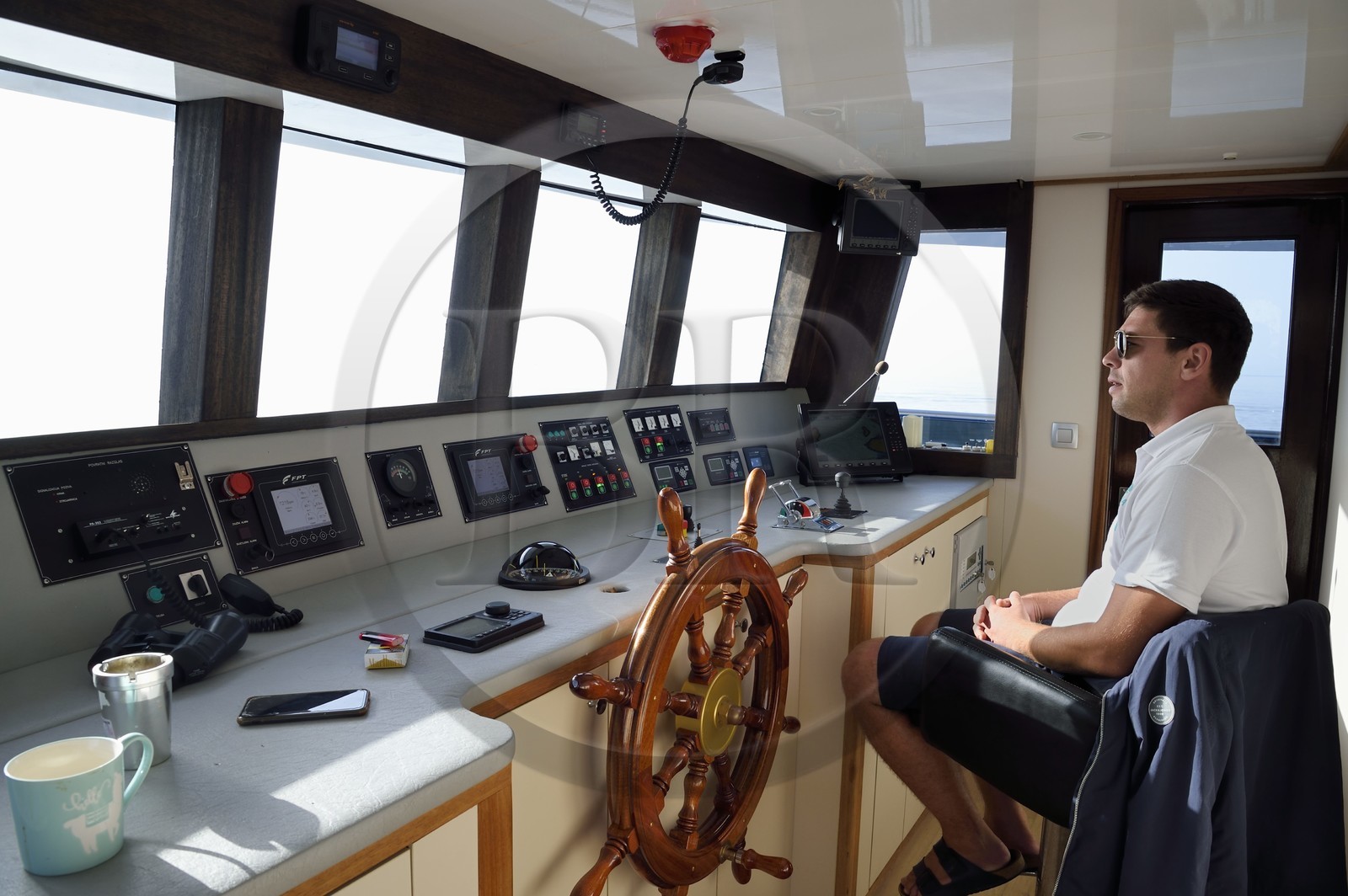 Croatia, Dalmatia, Dubrovnik, cruise ship Ave Maria and its captain Rade Naranca in the wheelhouse