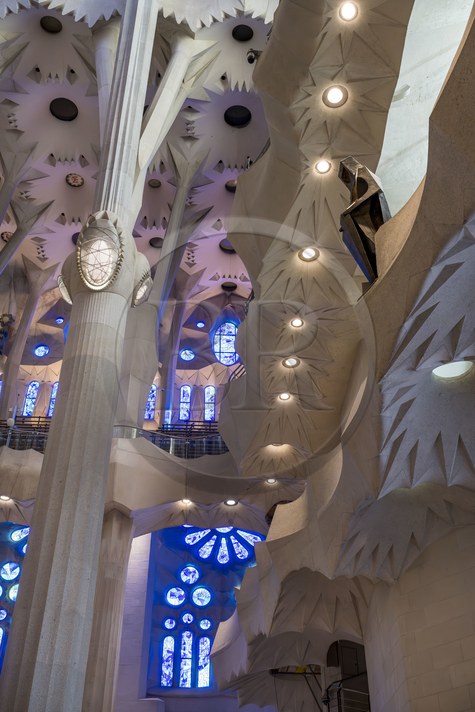 Spain, Catalonia, Barcelona, Eixample district, Sagrada Familia basilica by Catalan modernist architect Antoni Gaudi, listed as a UNESCO World Heritage Site, the east side of the Nave and bronze statue of Saint George by the sculptor Subirachs in the center of the interior of the facade of Glory