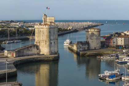 France, Charente Maritime, La Rochelle, the Old Port, Tour Saint Nicolas and Tour de la Chaine protect the entrance to the Old Port, the tour de la Lanterne in the background (aerial view)