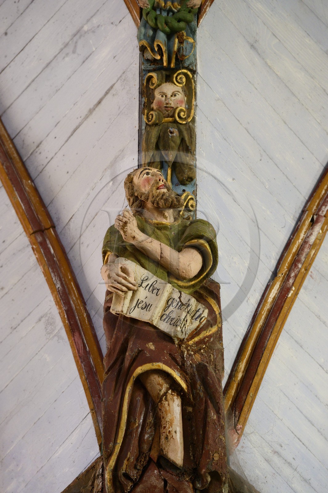 France, Finistere, Pleyben church, wooden painted sculptures on the stringer decorating the vault