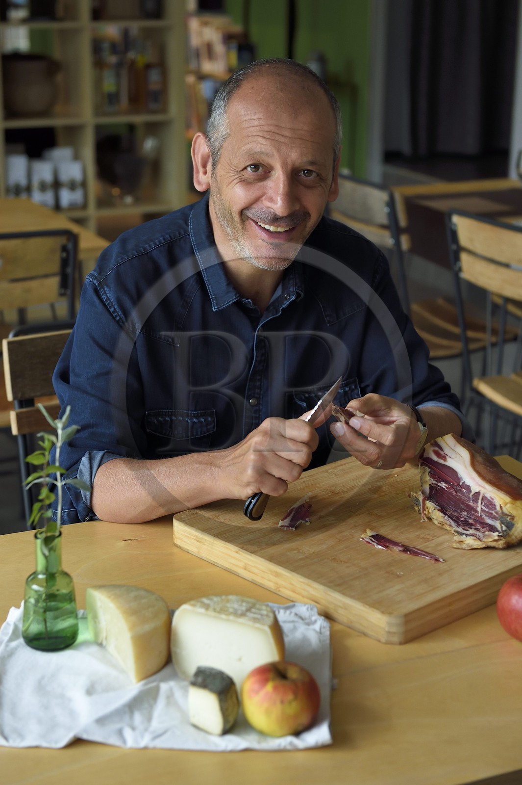 France, Corse du Sud, Prunelli river valley, Bastelica, Boutique Hotel Artemisia, its director Christophe Gandon taste a country ham together with local produce, apple, goat and sheep cheese
