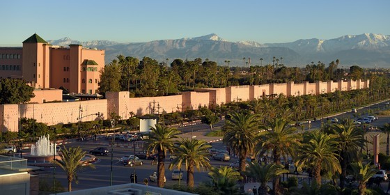 Morocco, High Atlas, Marrakech, Imperial city, Medina listed as World Heritage by UNESCO, Mamounia luxury hotel behind the ramparts of the city and the snow-covered Atlas in the background