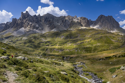 France, Hautes Alpes, Briancon region, Nevache, the upper Clarée valley, hikers in the upper Clarée valley, the Cerces massif in the background