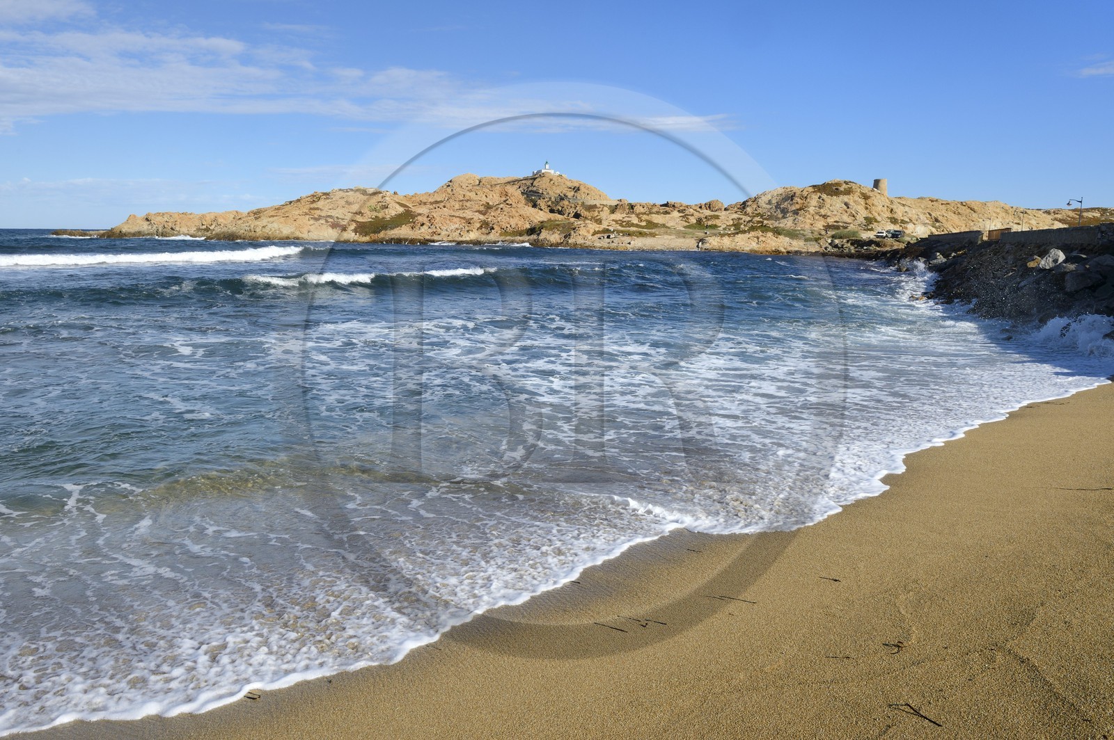 France, Haute Corse, Balagne, L'Ile Rousse, the Pietra Lighthouse and the fifteenth century Genoese tower behind the beach