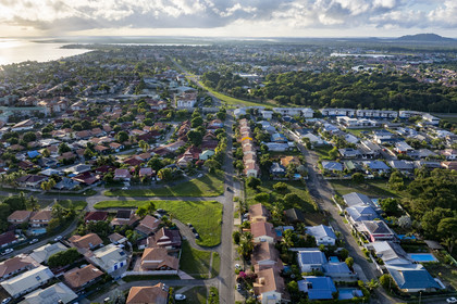 France, French Guiana, the city of Kourou, the mouth of the Kourou river in the background (aerial view)