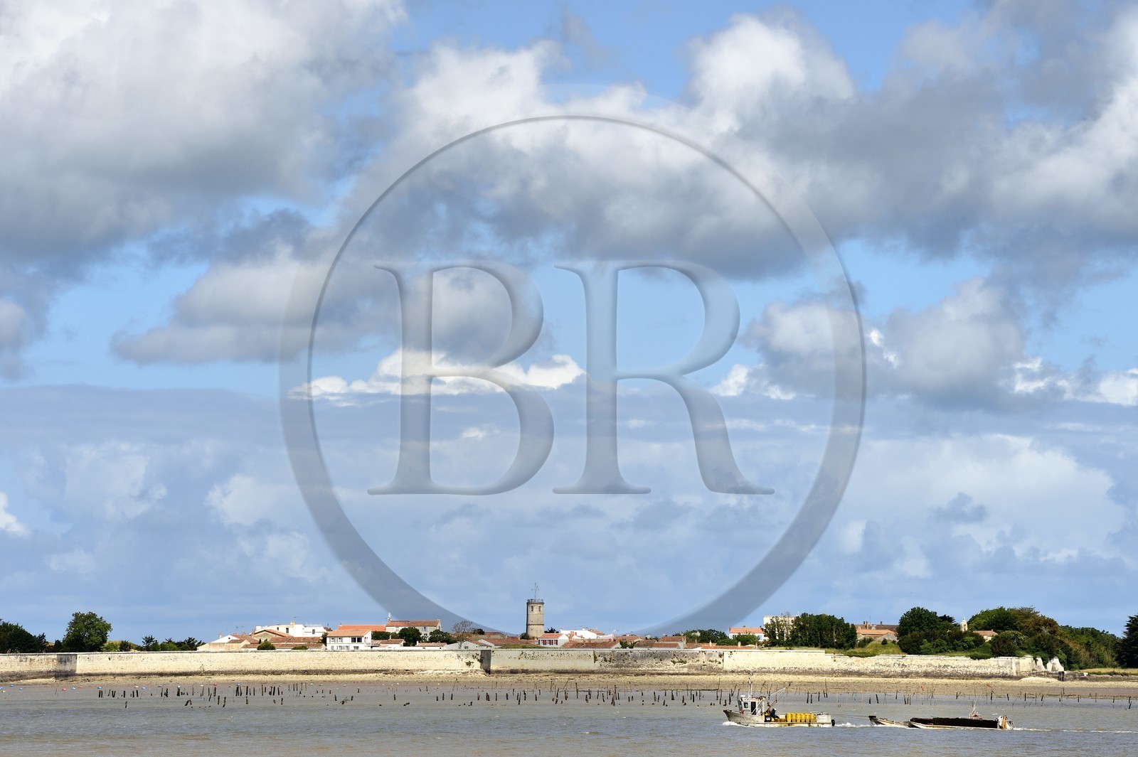 France, Charente-Maritime, Ile d'Aix (Aix Island), the village also called the bourg and an oyster barge in the foreground