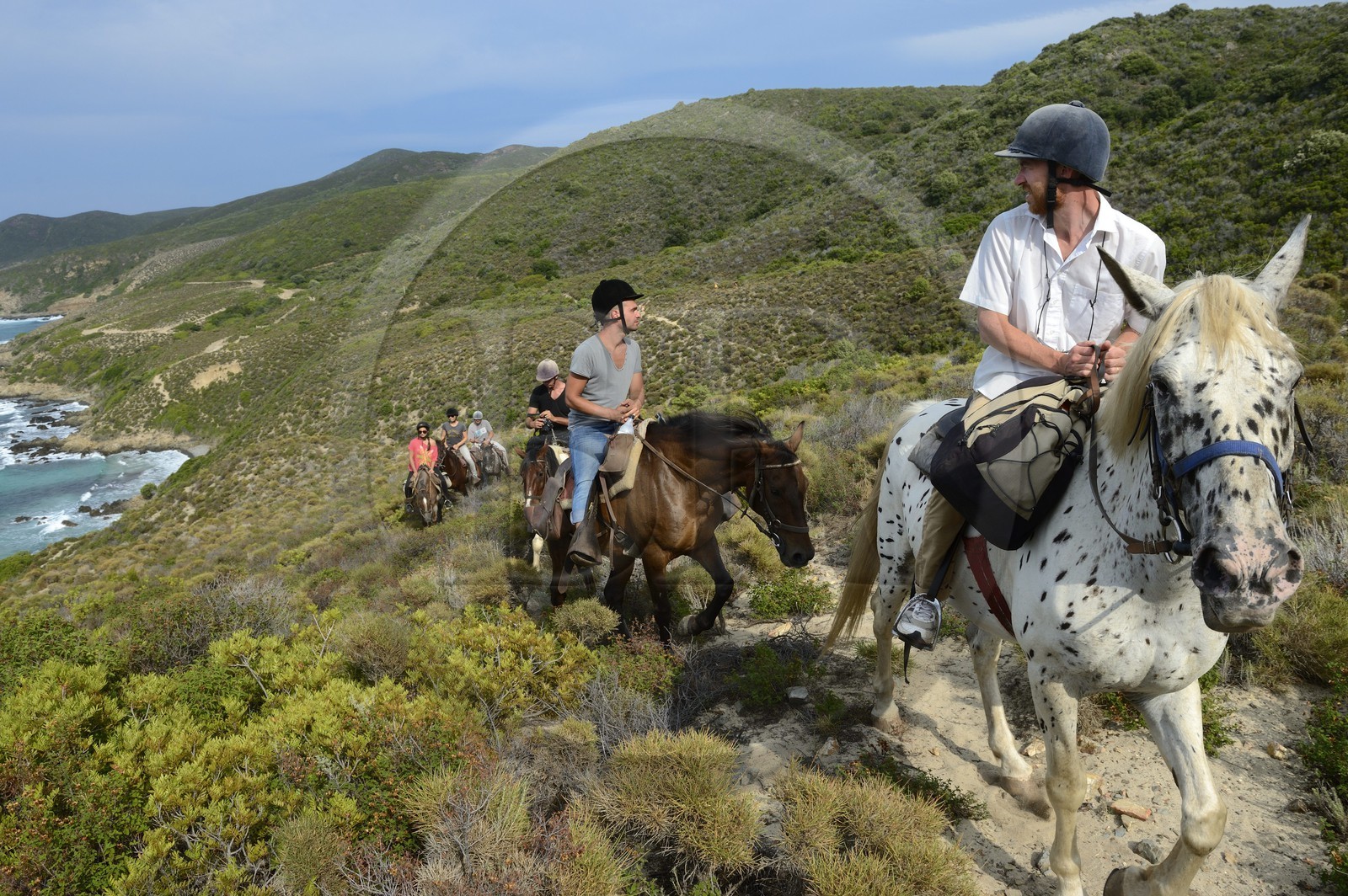 France, Haute Corse, Nebbio, Punta di l’Acciolu (Acciola), riders trekking in the Agriates Desert