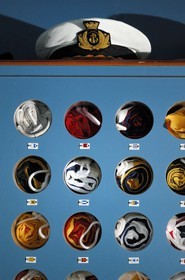 Italy, cruise aboard the Silvershadow ship of the company Silversea, flags locker and caps of officers