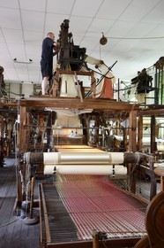 France, Rhone, Lyon, La Croix Rousse District, Silk manufacturer Prelle, silk loom developed by Joseph Marie Jacquard called Jacquard loom, the canut (lyonnais silk worker) Sebastien making adjustments