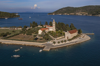 Croatia, Dalmatia, Dalmatian coast, Island of Vis, village of Vis, Saint-Jerome monastery built in the 16th century by the Franciscans on the small peninsula of Pirovo (aerial view)