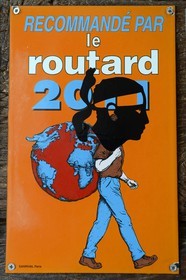 France, Corse du Sud, Alta Rocca, Sainte-Lucie-de-Tallano (Santa Lucia di Tallà), french tourist sign from the travel guide the Routard with a special corsican add with the Moor's head emblem of Corsica