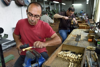 France, Dordogne, Périgord Vert, Nontron, manufacturing knives in the Coutellerie Nontronaise Factory, pattern of the handle pyrography