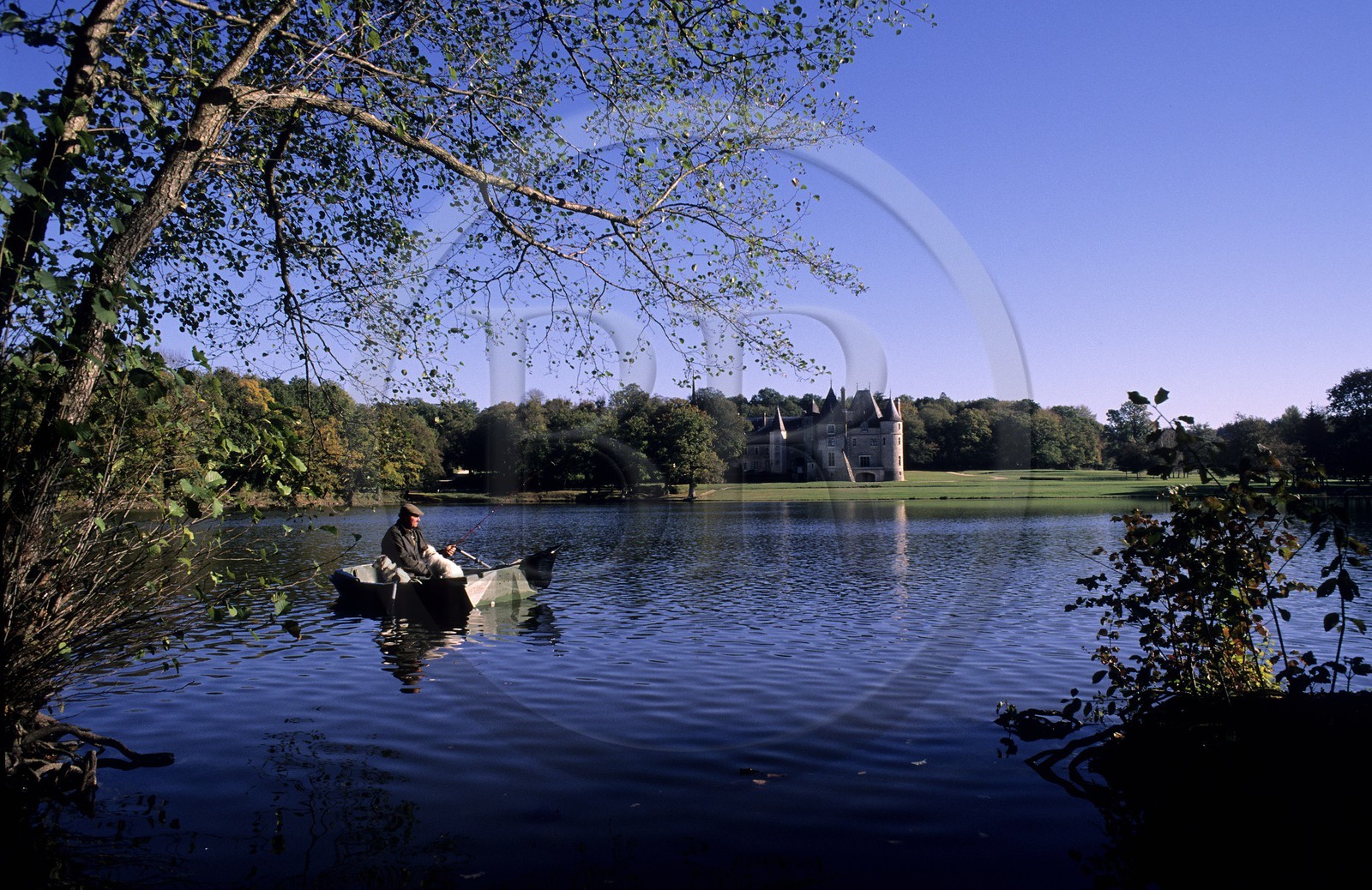 France, Cher, Oizon, fisherman on the lac from La Verrerie castle
