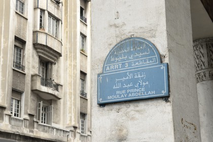 Morocco, Casablanca, street sign and Art Deco building