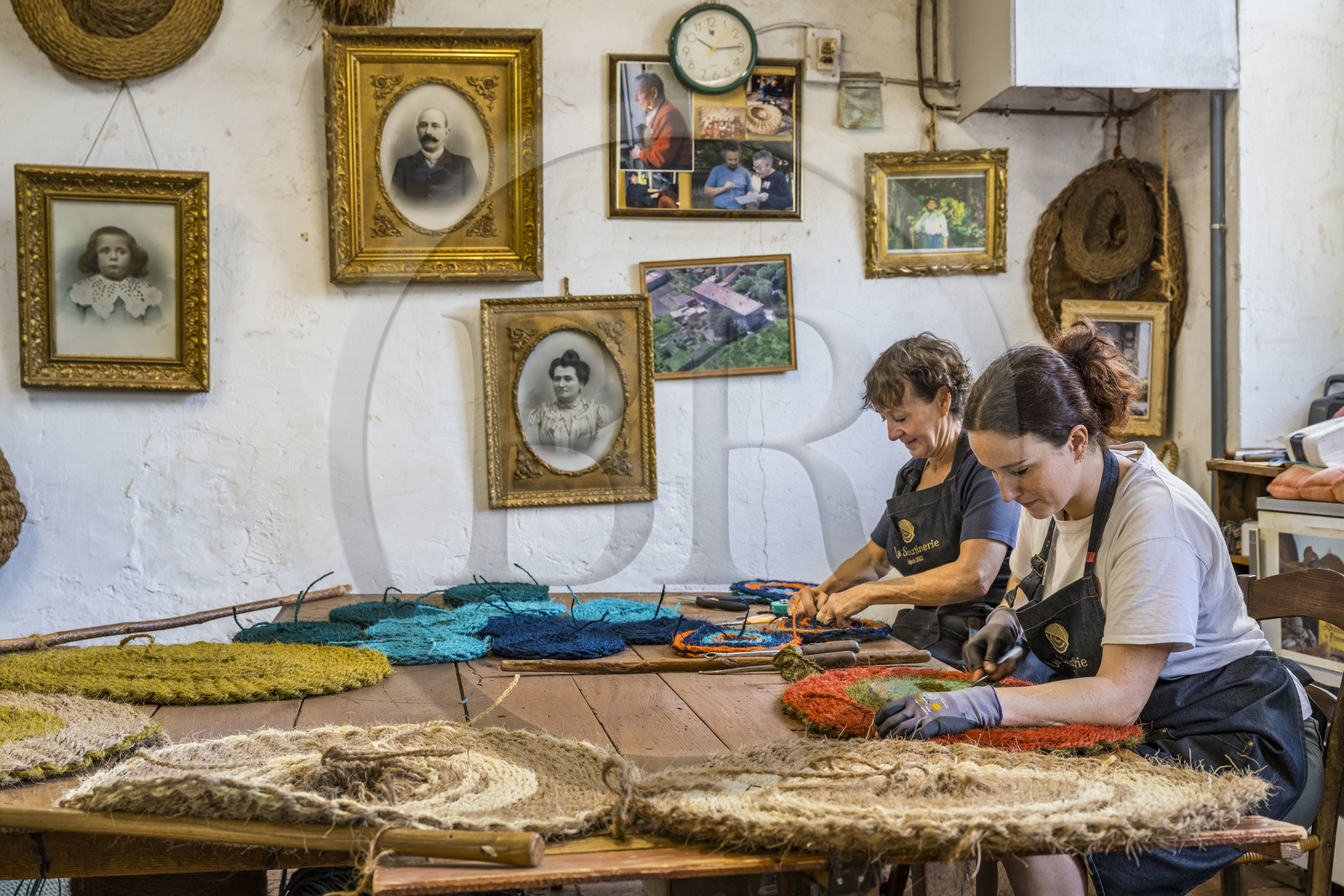 France, Drome, Drome provencale, Nyons, La Scourtinerie, the last scourtin factory in Provence, traditional filters used in the production of olive oil but also designed today as decorative objects made of coconut fiber, hand finishing of scourtins by Sophie Villeneuve-Fert and her mother Frédérique